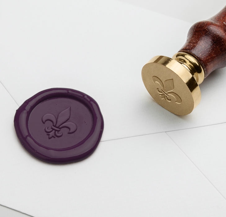 Papier Plume wax seal featuring a Fleur de Lis symbol, crafted for sealing letters and adding elegant detail to stationery.