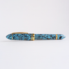 Gioia Capodimonte Kawari gold trim fountain pen with intricate design and glossy black finish, close-up of pen tip and decorative details.