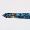 Gioia Capodimonte Kawari gold trim fountain pen with intricate design and shiny gold accents on smooth black body.