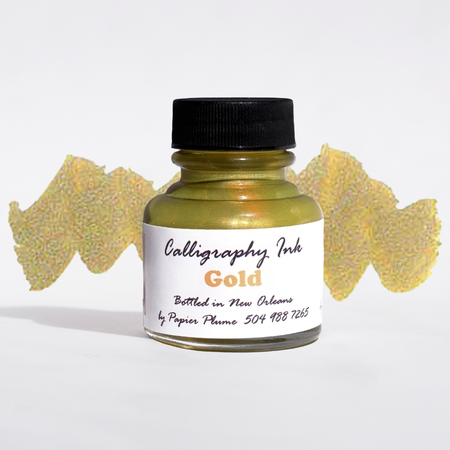 Gold bottled metallic calligraphy ink by Papier Plume, showcasing a smooth, shiny ink suitable for elegant lettering and artwork.