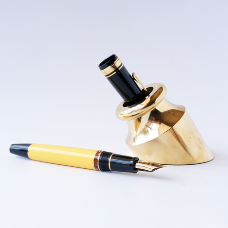 Gold Penwell brass pen holder featuring a classic design with a polished brass finish.