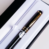 Pilot Grance black fountain pen with sleek design and silver accents, shown with cap on and ink nib visible.