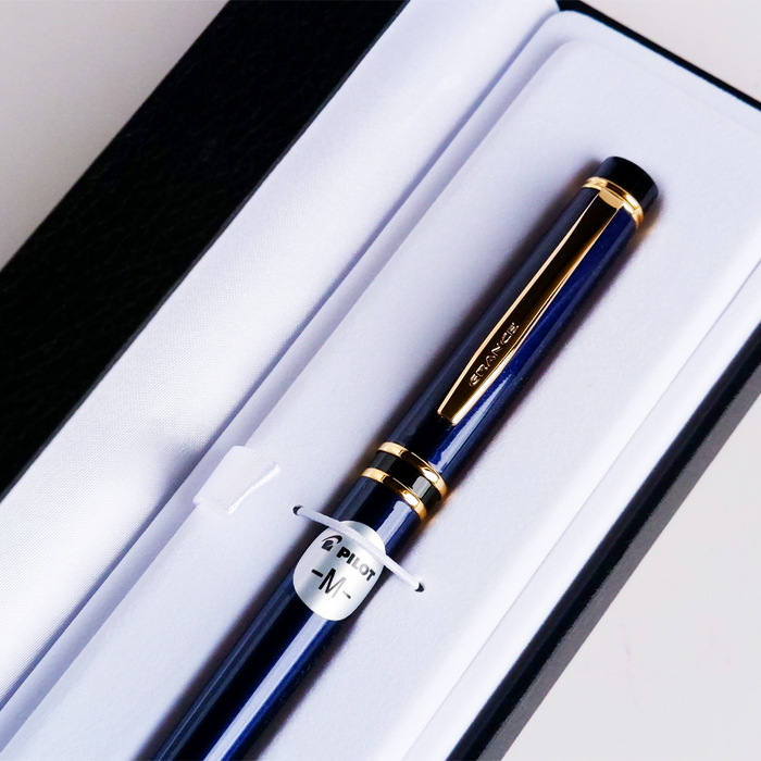 Pilot Grance navy fountain pen with gold accents, sleek dark blue body, and ergonomic design for smooth writing.