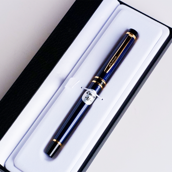 Pilot Grance navy fountain pen with sleek dark blue barrel and gold accents, showcasing elegant writing instrument design.