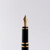 Pilot Grance fountain pen with pearl pink resin body and gold accents, featuring a sleek design and a fine nib.