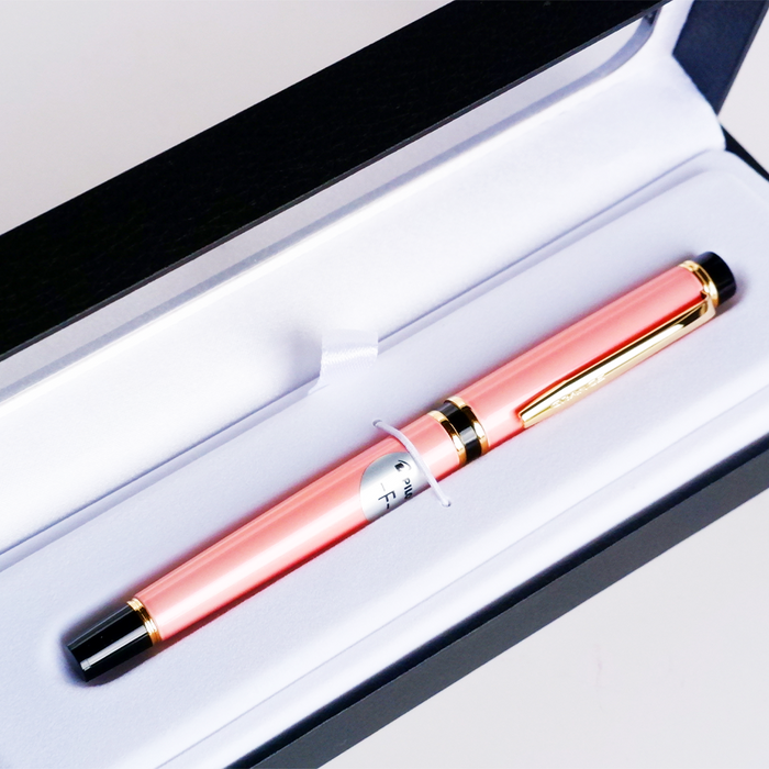 Pilot Grance Pearl Pink fountain pen with a sleek pink barrel and gold accents, displayed on a white background.