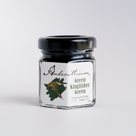 Anderillium Green Kingfisher Green fountain pen ink bottle with vibrant green ink visible inside.