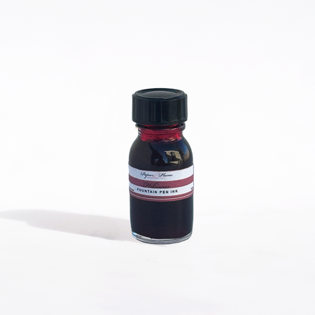 Papier Plume fountain pen ink in Hibiscus color, vibrant pinkish-red ink bottle with ink swatch and label.
