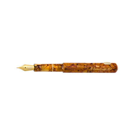 Esterbrook Niblet fountain pen with honey-colored barrel and metal nib, showcasing its elegant design and smooth writing tip.