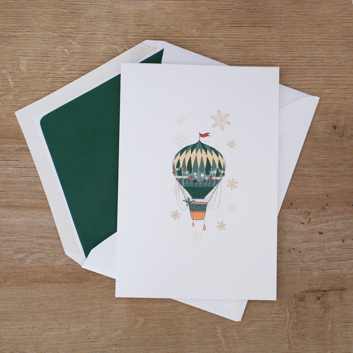 Rossi Christmas card featuring a colorful hot air balloon design with festive holiday elements and winter scenery.