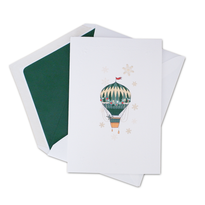 Rossi Christmas card featuring a colorful hot air balloon flying over a winter landscape with festive holiday accents.