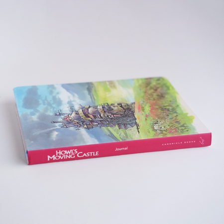 Chronicle Books Howl's Moving Castle journal with illustrated cover, perfect for writing and note-taking.