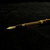 Pilot Custom 823 amber fountain pen with transparent amber resin barrel and gold accents.