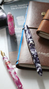 Esterbrook Estie Bestie fountain pen with a pink rose-colored barrel and gold accents on a white background.