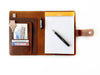 Dark Toscano brown leather notebook folio by Eng Leather Co. in A5 size, with textured leather exterior and stitched edges.