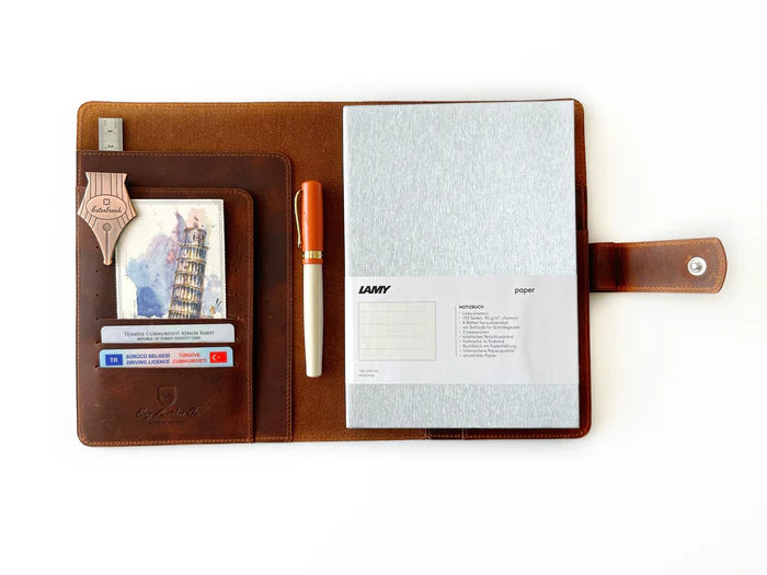 Eng Leather Co. A5 leather notebook folio in dark Toscano brown with a textured leather exterior and secure strap closure.