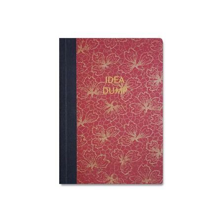 A Papier Plume Idea Dump journal with a sleek cover, open to blank pages for creative note-taking and idea jotting.