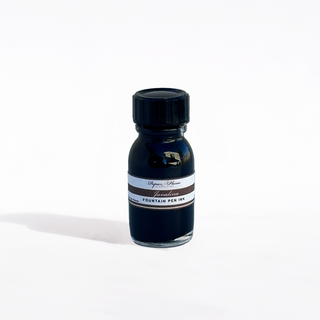 Papier Plume Javalina fountain pen ink bottle with black ink, featuring a sleek glass container and label design.