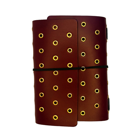 Juniper maroon journal cover by Imperfect Concepts with gold grommets, A6 trifold folio design, showcasing a stylish and functional cover.