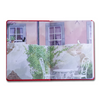 Open journal featuring Kiki's Delivery Service theme from Studio Ghibli, with colorful cover art and lined pages for writing.