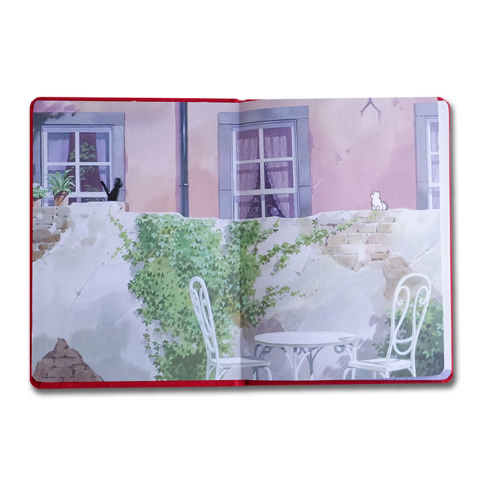 Open journal featuring Kiki's Delivery Service theme from Studio Ghibli, with colorful cover art and lined pages for writing.
