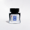 Bottle of Cathay Kirin fountain pen ink with a clear glass container and colorful ink inside, suitable for writing and calligraphy.