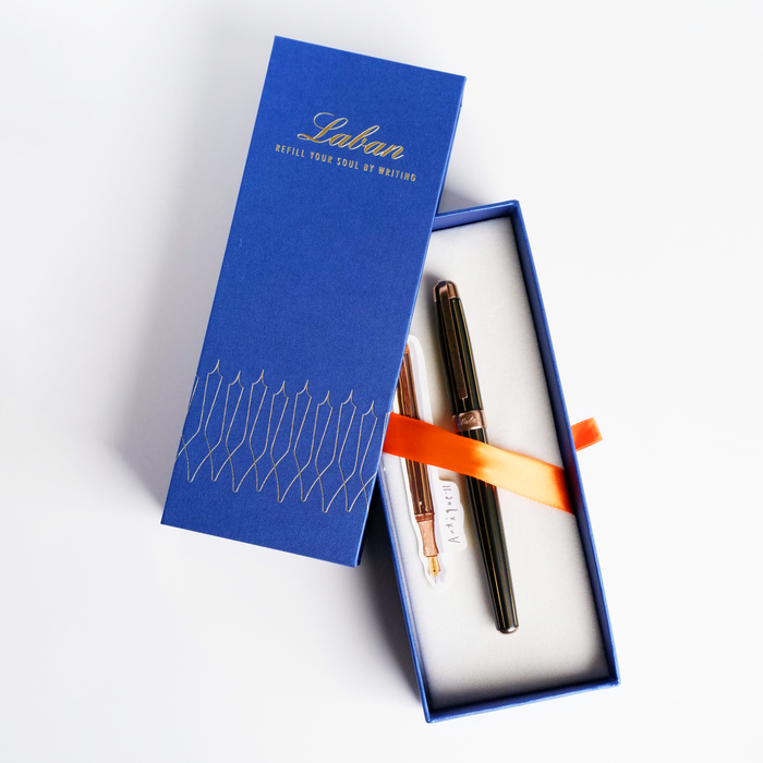 Laban Antique II fountain pen with black and gold design, showcasing elegant craftsmanship and smooth writing style.