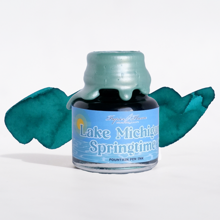 Papier Plume Lake Michigan Springtime fountain pen ink bottle, limited edition, with vibrant blue and green ink inside.