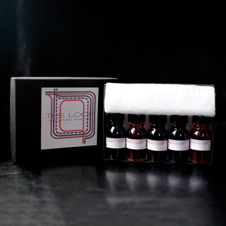 Papier Plume Loop Series fountain pen ink set with four colorful ink bottles, showcasing vibrant ink colors and elegant packaging.