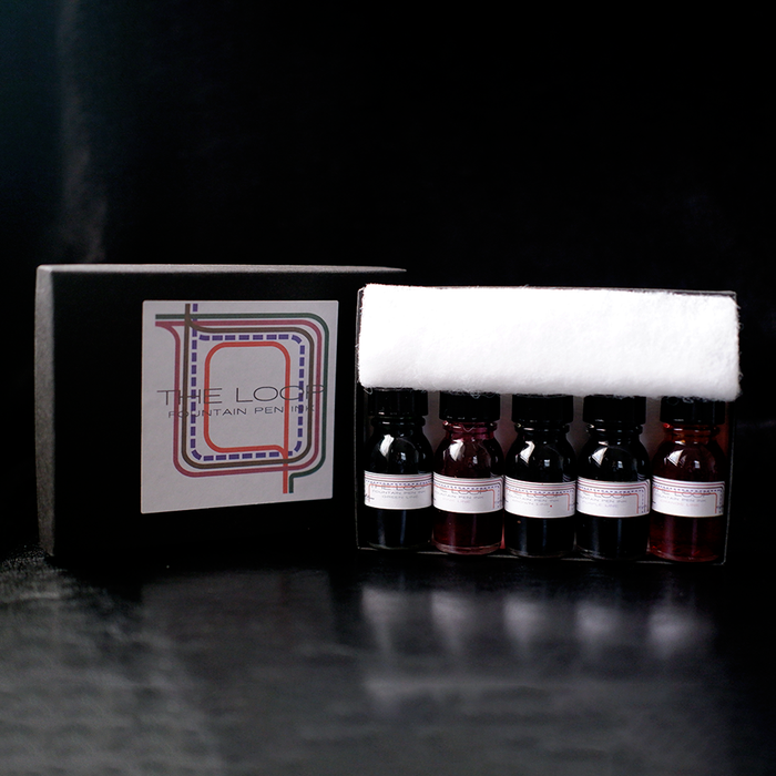 Papier Plume Loop Series fountain pen ink set with four colorful ink bottles, showcasing vibrant ink colors and elegant packaging.