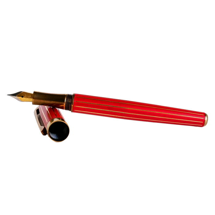 Red Laban Antique II fountain pen with silver accents, displaying a sleek design and smooth ink nib.