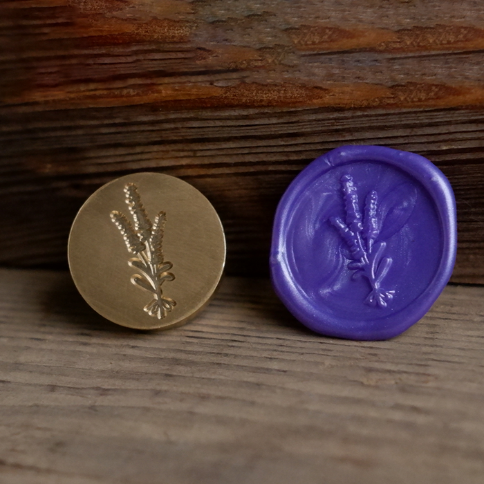 Lavender wax seal with flower scent from Papier Plume wax seal set, featuring intricate floral design on a smooth wax surface.
