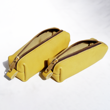 Yellow San Lorenzo pen case with a sleek, compact design, perfect for storing pens and small stationery items.