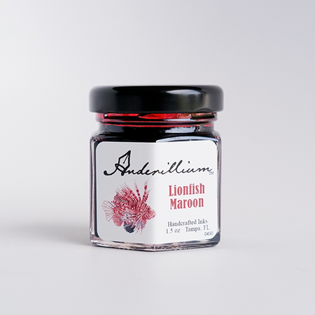 Anderillium Lion Fish Maroon fountain pen ink bottle with maroon-colored ink in a clear glass container.