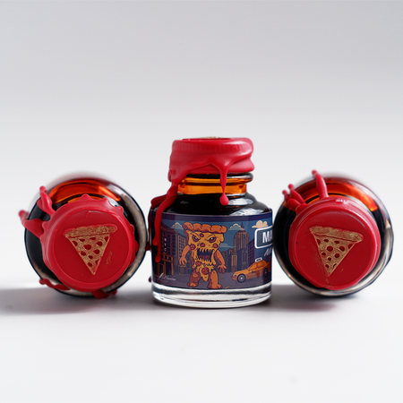 Papier Plume Manhattan Man-Eating Pizza fountain pen ink set with colorful ink bottles and packaging in a modern design.