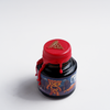 Papier Plume Manhattan Man-Eating Pizza fountain pen ink set with colorful ink bottles and packaging, ideal for writing and art projects.