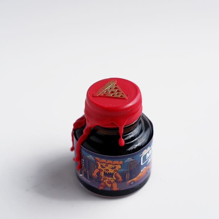 Papier Plume Manhattan Man-Eating Pizza fountain pen ink set with colorful ink bottles and packaging, ideal for writing and art projects.