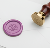 Papier Plume wax seal featuring a magnolia flower symbol, used for sealing letters and decorative crafts.