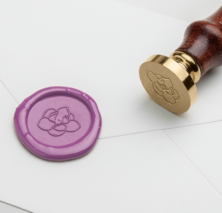 Papier Plume wax seal featuring a magnolia flower symbol, used for sealing letters and decorative crafts.