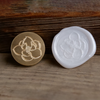 Magnolia wax seal stamp from Papier Plume's flower scented wax seal set, featuring a detailed magnolia flower design.