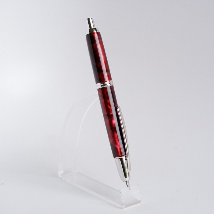 Pilot Vanishing Point SE fountain pen in marble red with gold accents, showcasing its sleek design and premium craftsmanship.