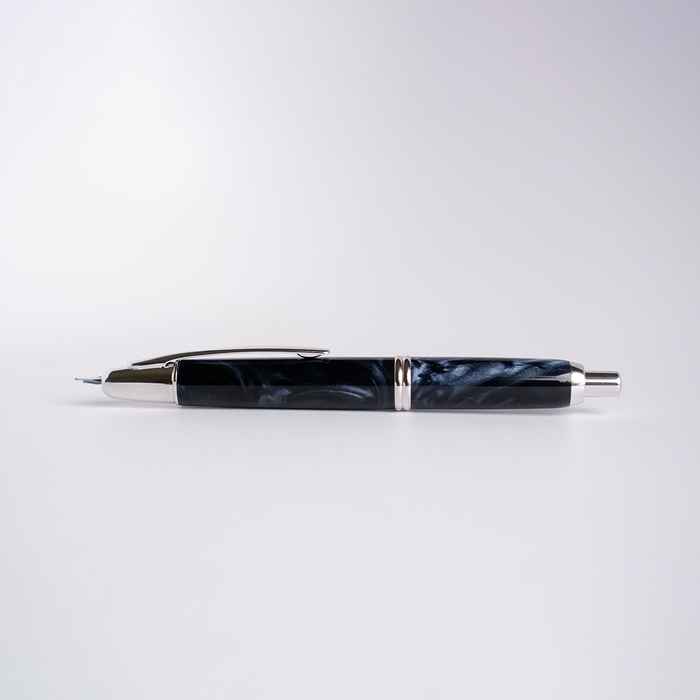 Pilot Vanishing Point SE fountain pen in Marble Blue with a sleek, curved design and gold accents.