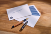 Esterbrook X Crane The Mariner fountain pen with deep blue and gold accents, showcasing its elegant design and fine nib.