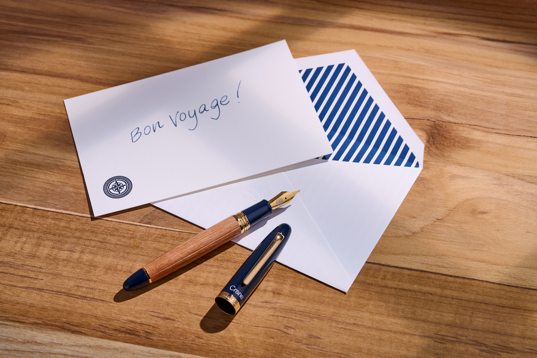 Esterbrook X Crane The Mariner fountain pen with deep blue and gold accents, showcasing its elegant design and fine nib.