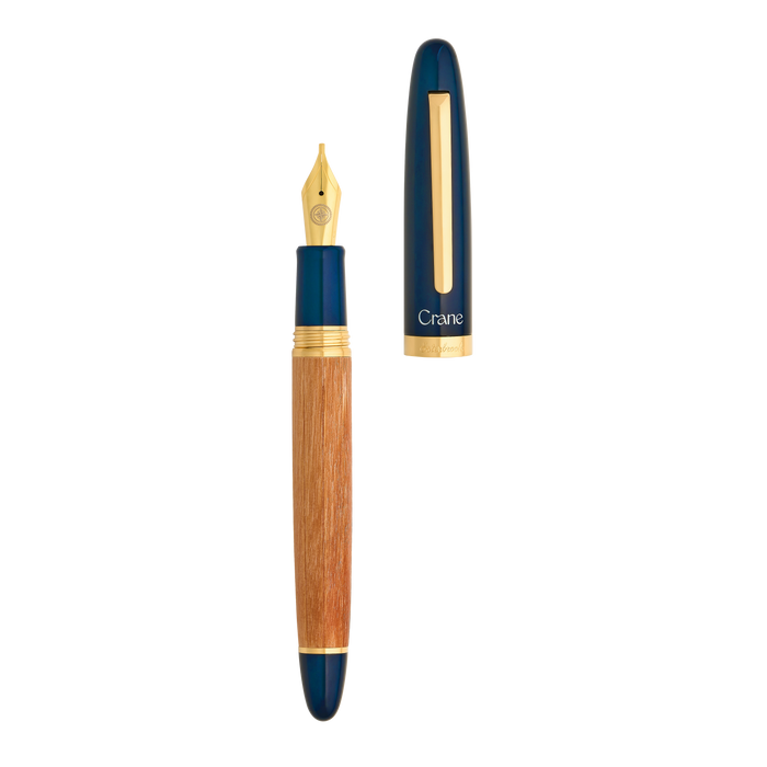 Open Esterbrook X Crane The Mariner fountain pen showing a sleek metal barrel and nib, highlighting its elegant design and craftsmanship.