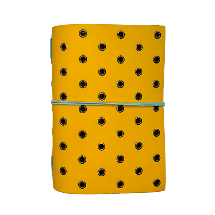 Yellow leather journal cover by Imperfect Concepts with gunmetal grommets, designed for A6 bifold folio notebooks.