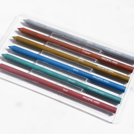 Pacific Arc metallic 5.6mm lead, a shiny graphite pencil lead, shown in a close-up image with a metallic finish.