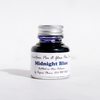 Papier Plume fountain pen ink in a bottle, showcasing rich midnight blue ink suitable for elegant writing and calligraphy.