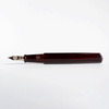 Cathay Diamond Tamenuri fountain pen with a glossy red Aka finish, featuring a sleek design and gold accents on a black background.