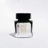 Cathay Moonlit Bronze fountain pen ink bottle with bronze-colored ink visible in the glass container.